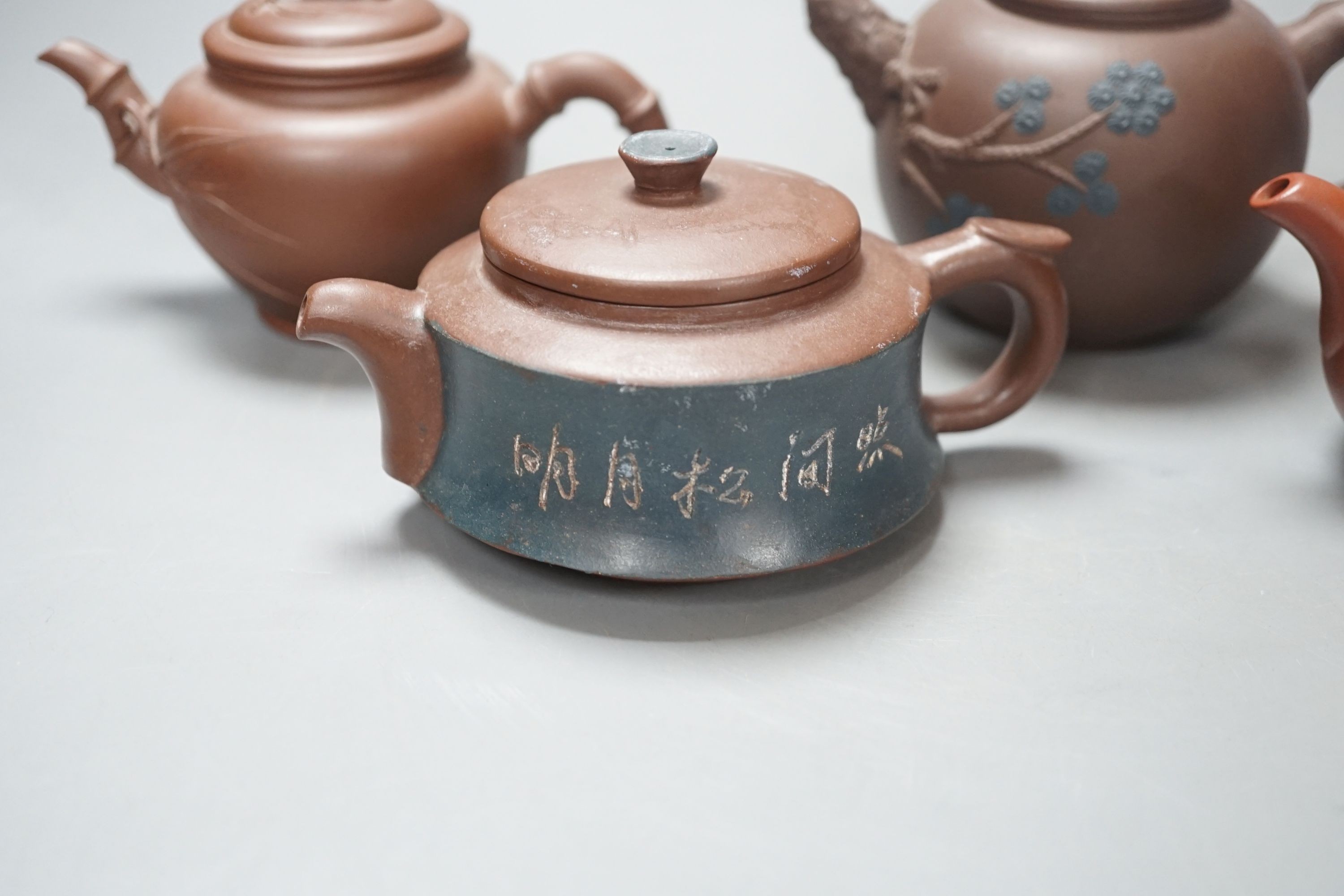 A group of four Yixing pottery teapots - tallest 11cm